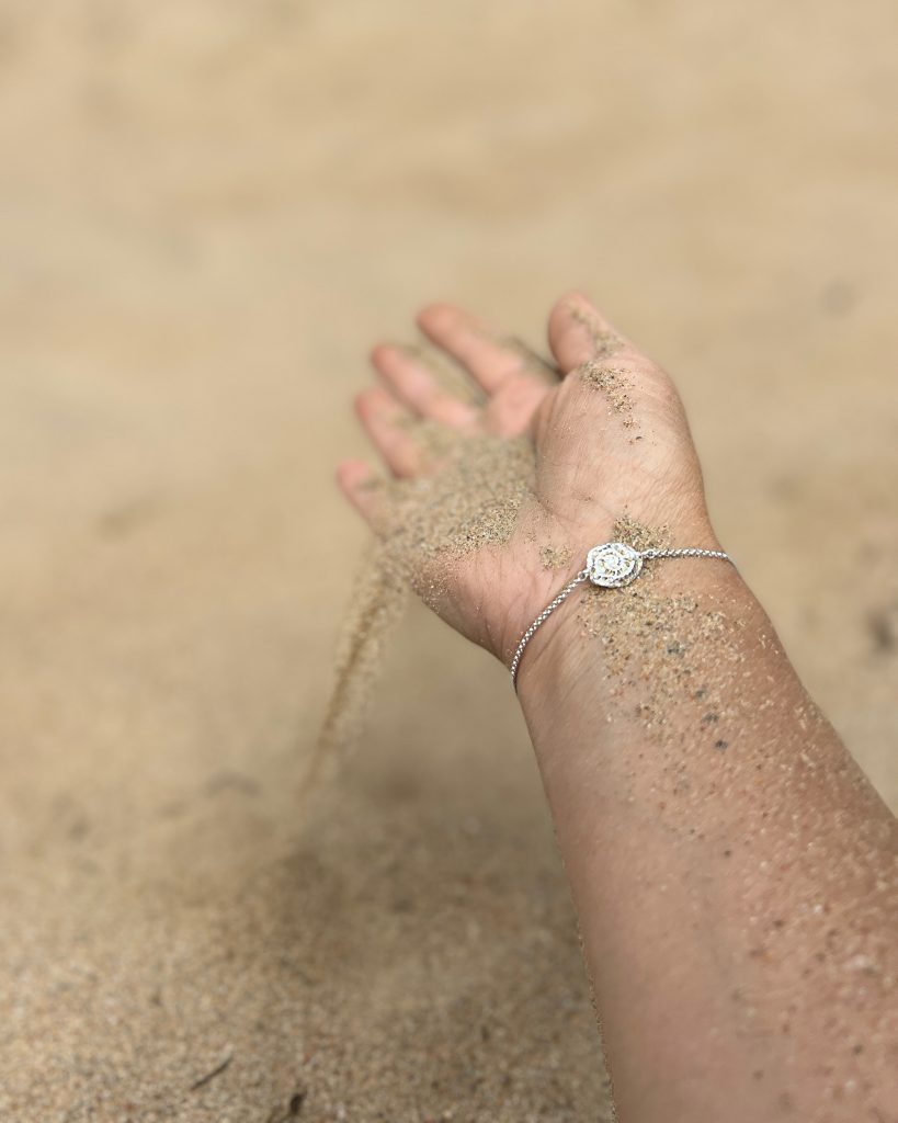 Silver bracelet shaped after a grain of sand